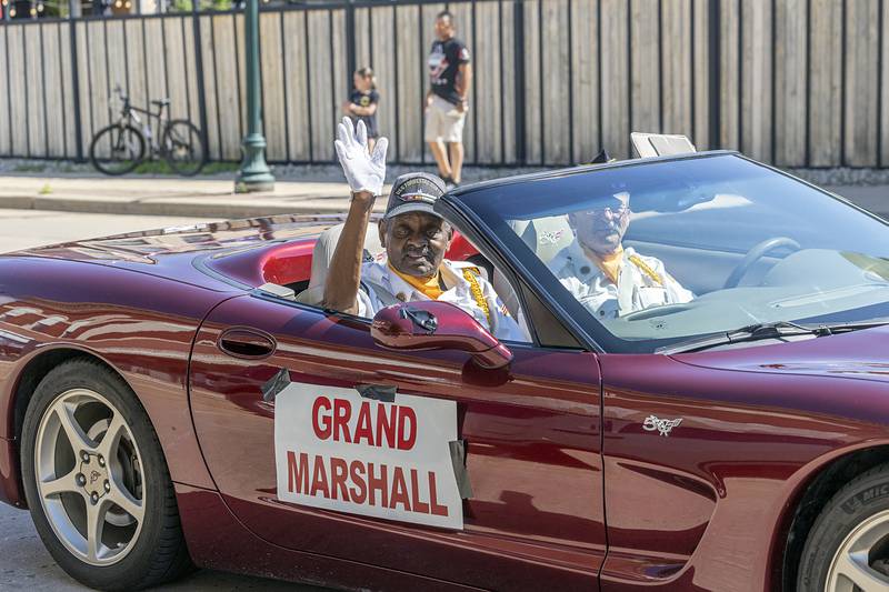 Grand Marshal Marvin Williams waves from the parade route Monday, May 25, 2026.