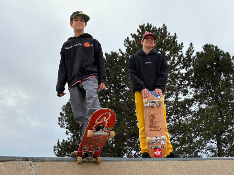 Sid Fox, 12, right, and Noah Gere, 13, on Monday, Nov. 17, 2025, at McHenry's Ryan Bus Zone Skate Park. The friends are designing and selling skateboard decks locally.