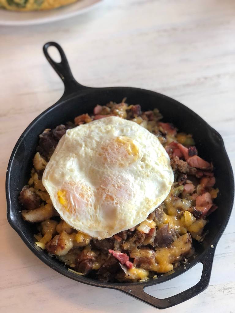 The carnivore skillet at Syrup in Algonquin is made with ham-off-the-bone; thick-cut, hickory-smoked bacon; onions; and green peppers topped with an egg.