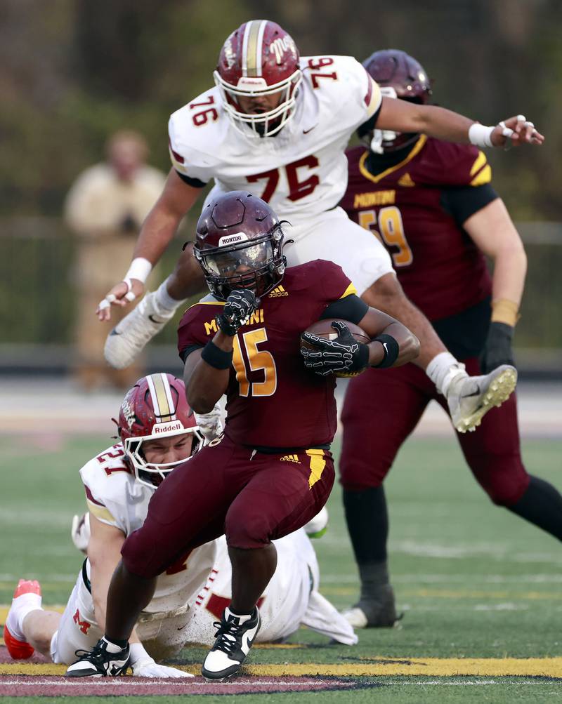 Morris' Malachi Congo (76) and Colin Zierman (27) try to catch Montini's Charles Flowers (15) during the IHSA Class 4A semifinals football playoff game Saturday, Nov. 22, 2025 in Lombard.