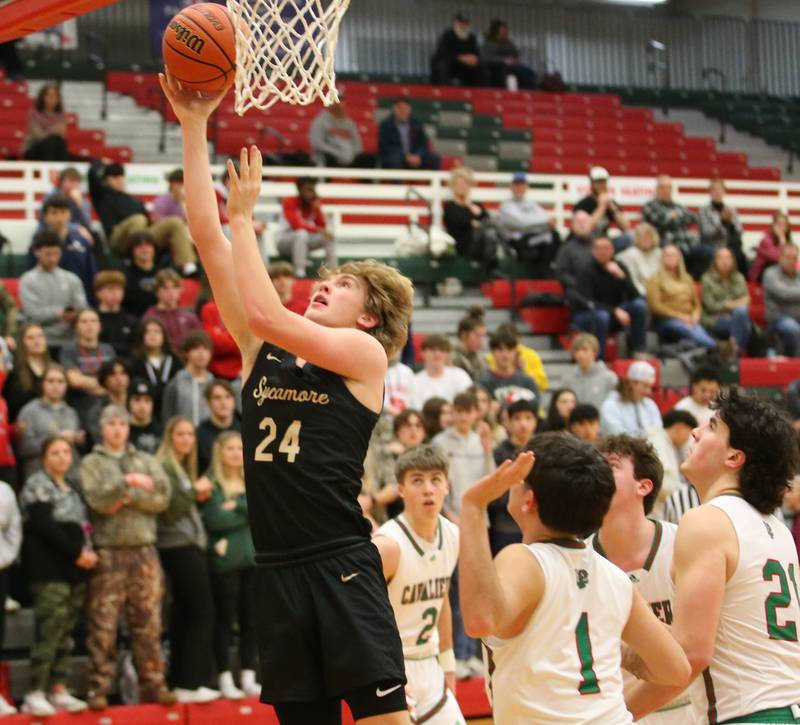 Sycamore's Lucas Winburn dribbles into the lane to score a basket against L-P defenders on Tuesday, Jan. 31, 2023 at L-P High School.