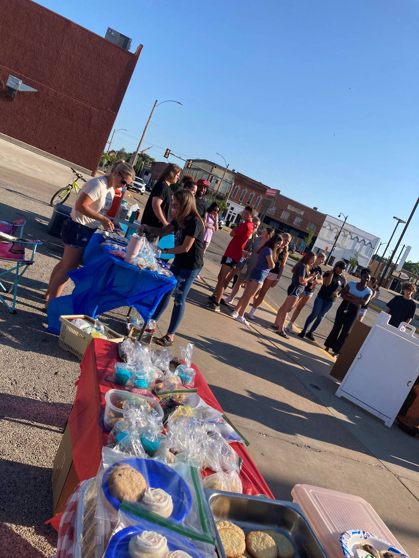 Dozens of students hosted a bake sale and lemonade stand Sunday, July 30, 2023, on the 100 block of North Park Street to raise money for Jermaine McIntyre, a teenager who died following a drowning emergency Friday in Leland.