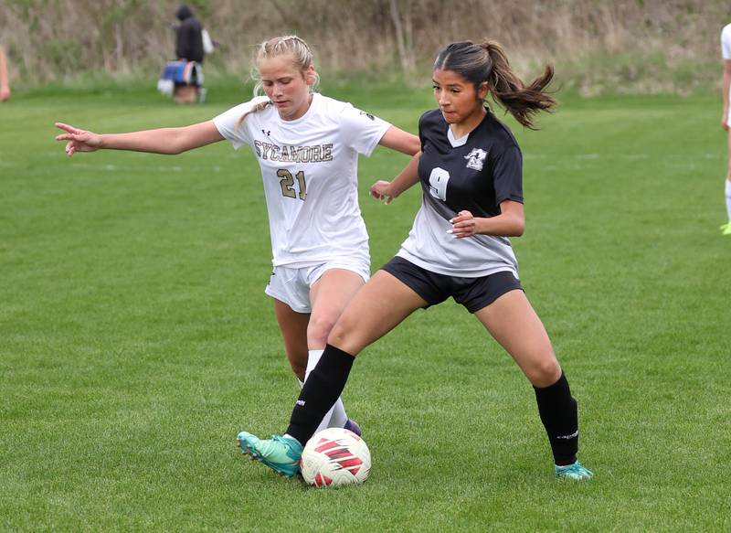 Sycamore's Kelsie Ryder (left) and Kaneland's Alondra Mendoza try to gain possession Wednesday, April 30, 2025, during their game at Kaneland High School in Maple Park.