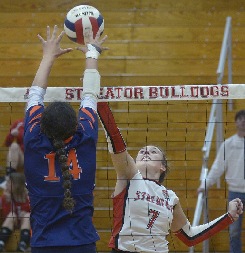 Streator’s Ava Gwaltney works to get the ball past the block of Pontiac’s Alix Robinson in the first set Wednesday at Streator.