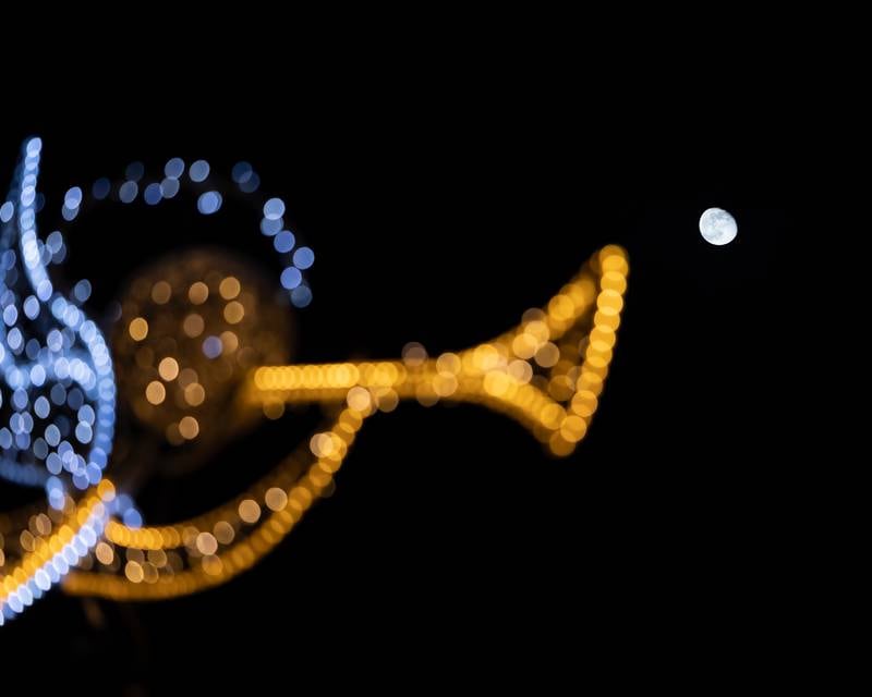 A near full moon shines onto downtown La Salle during Frosty on First on Friday, November 7, 2025 on First Street in La Salle.