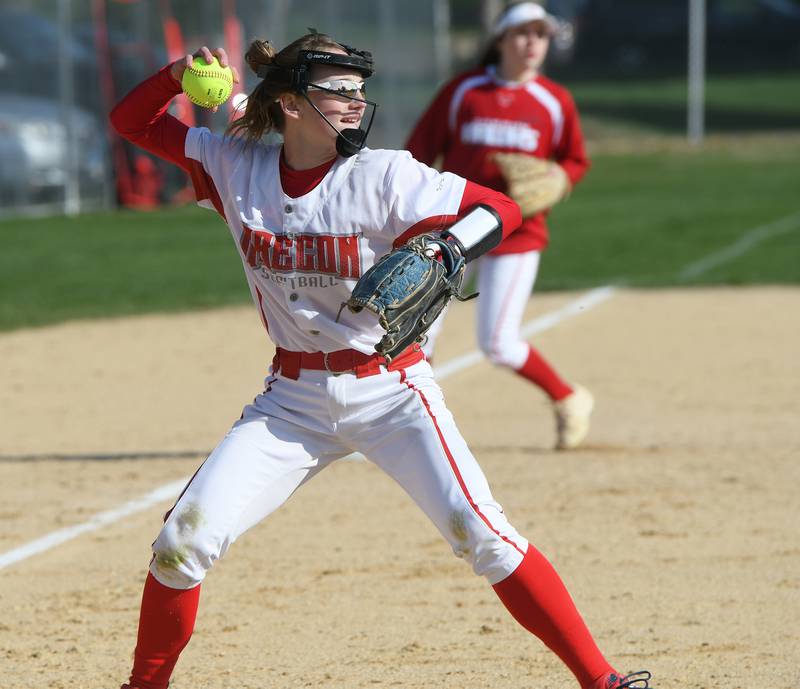 Oregon's Ella Dannhorn throws to first for an out against Dixon on Tuesday.