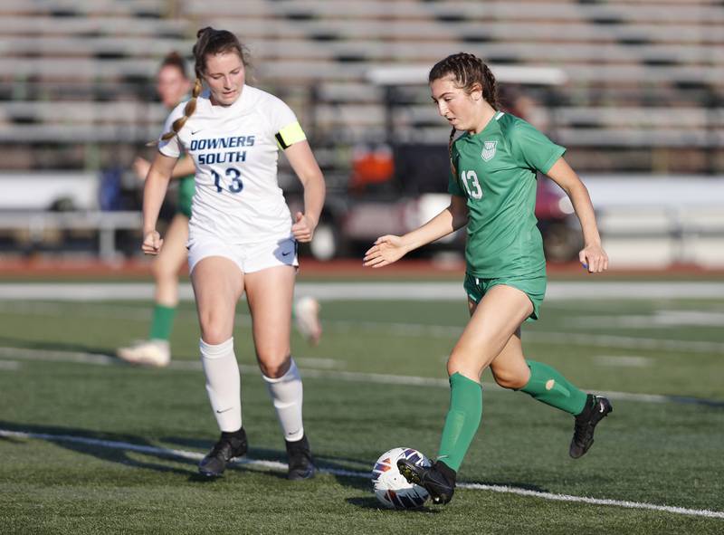 York's Jordan Ebner (13) brings the ball up the pitch during the Class 3A Morton regional girls soccer final between Downers Grove South and York in Berwyn on Friday, May 17, 2024.