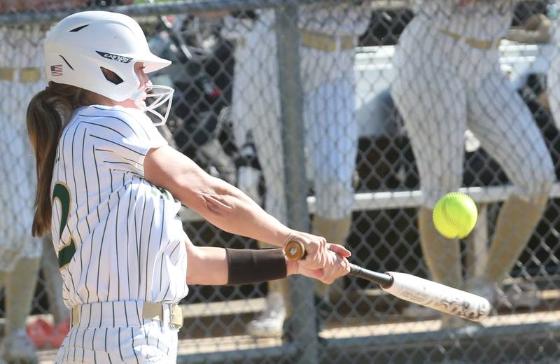 St. Bede's Ella Hermes makes contact with the ball against Woodland/Flanagan-Cornell on Monday, April 29, 2024 at St. Bede Academy.