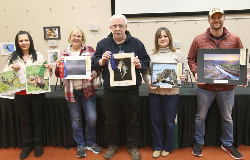 (From left) Heather Farrell, 4th place in show; Tammy Zellers, 2nd place in show; Jim Rendant, best of show; Heather Farrell, 4th place in show and Billy Zborowski 1st place in show pose for a photo with their winning entries during the Starved Rock Photography Show awards on Saturday, Jan. 4, 2024 at the Starved Rock Visitors Center.