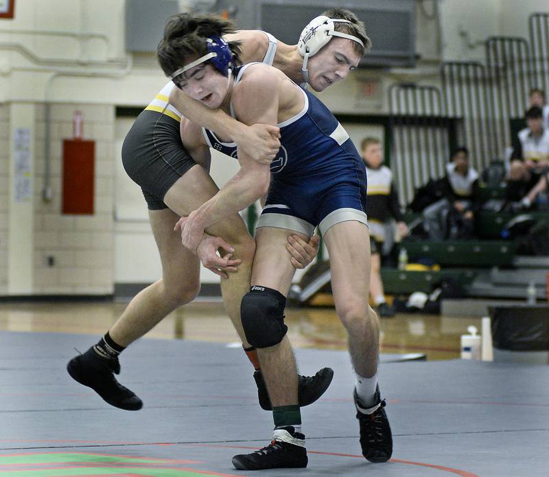 Joliet Catholic’s Owen O’Connor works to bring down Lemont’s Evan Schiffman in the 138-pound championship match during Saturday's Class 2A regional at La Salle-Peru High School.