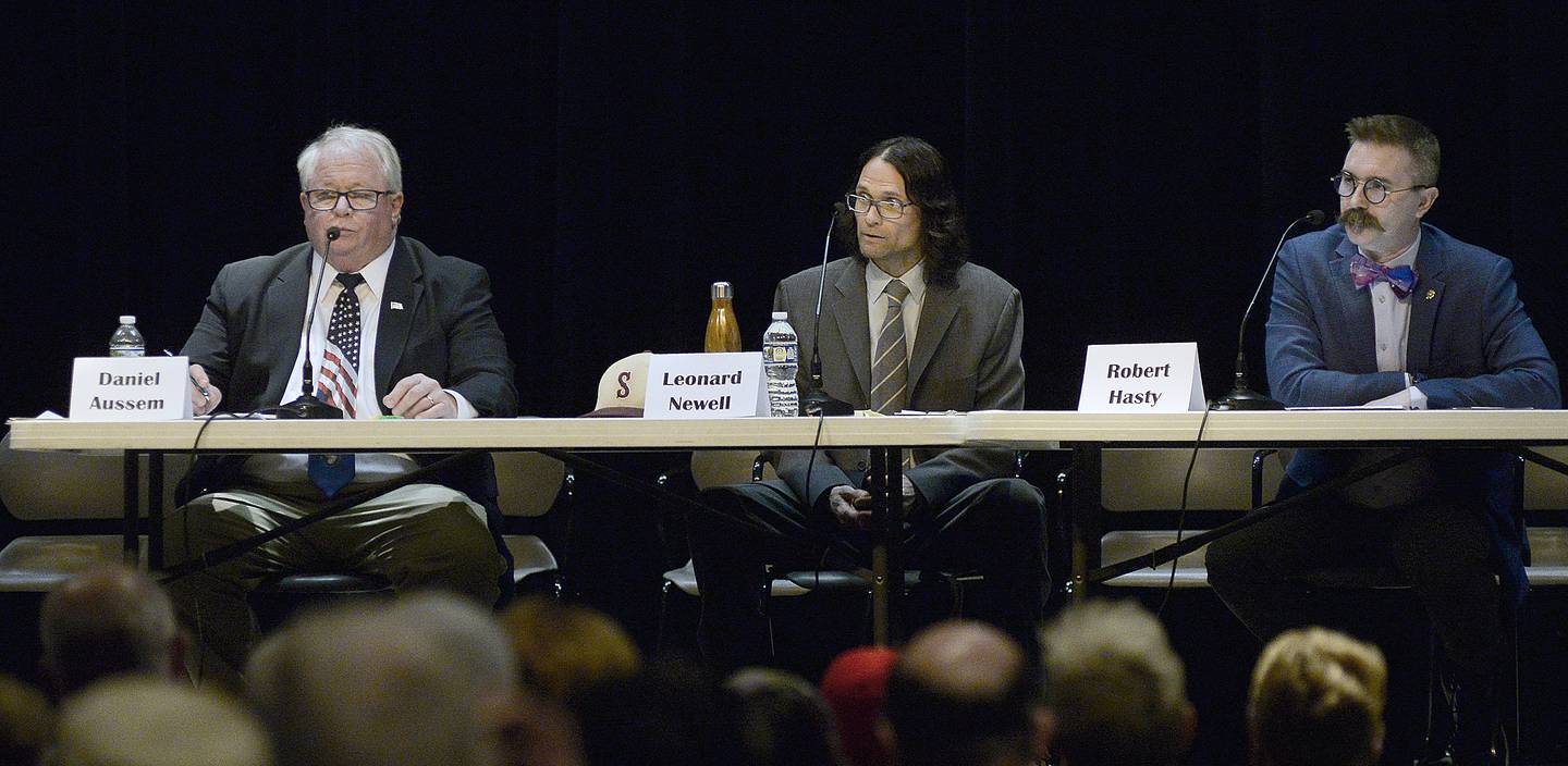 Ottawa mayoral candidate (left to right) Daniel Aussem, Leonard Newell and Robert Hasty answer questions Monday, March 13, 2023, during a candidates forum at Central Intermediate School.