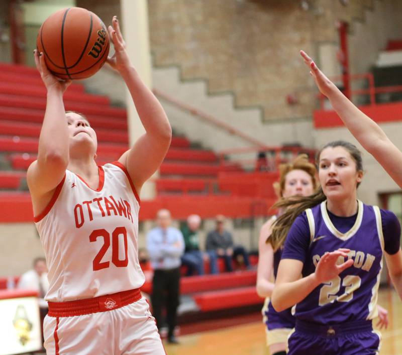 Ottawa's Kendall Lowery runs into the lane to score a basket over Canton defenders during the Lady Pirate Holiday Tournament on Wednesday, Dec. 21, 2022 in Ottawa.