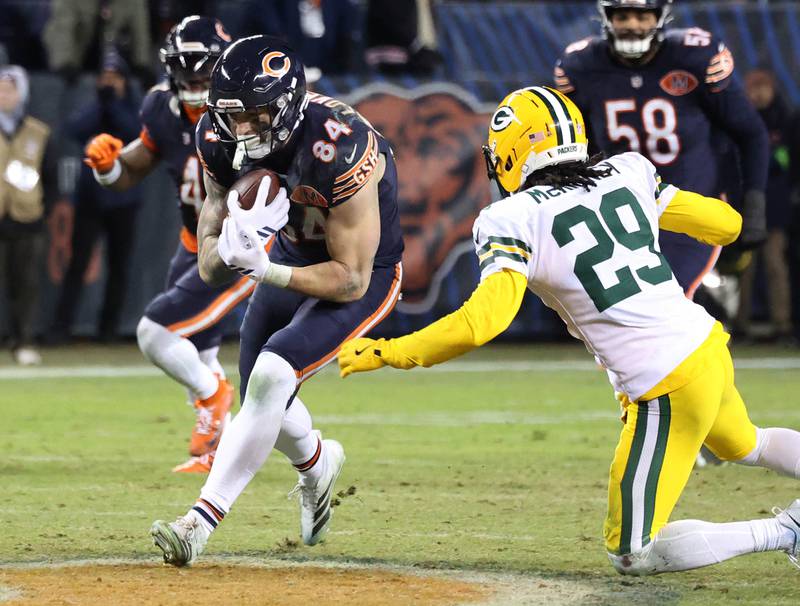 Chicago Bears tight end Colston Loveland prepares for contact with Green Bay Packers safety Xavier McKinney during their NFL Wild Card game Saturday, Jan. 10, 2026, at Soldier Field in Chicago.
