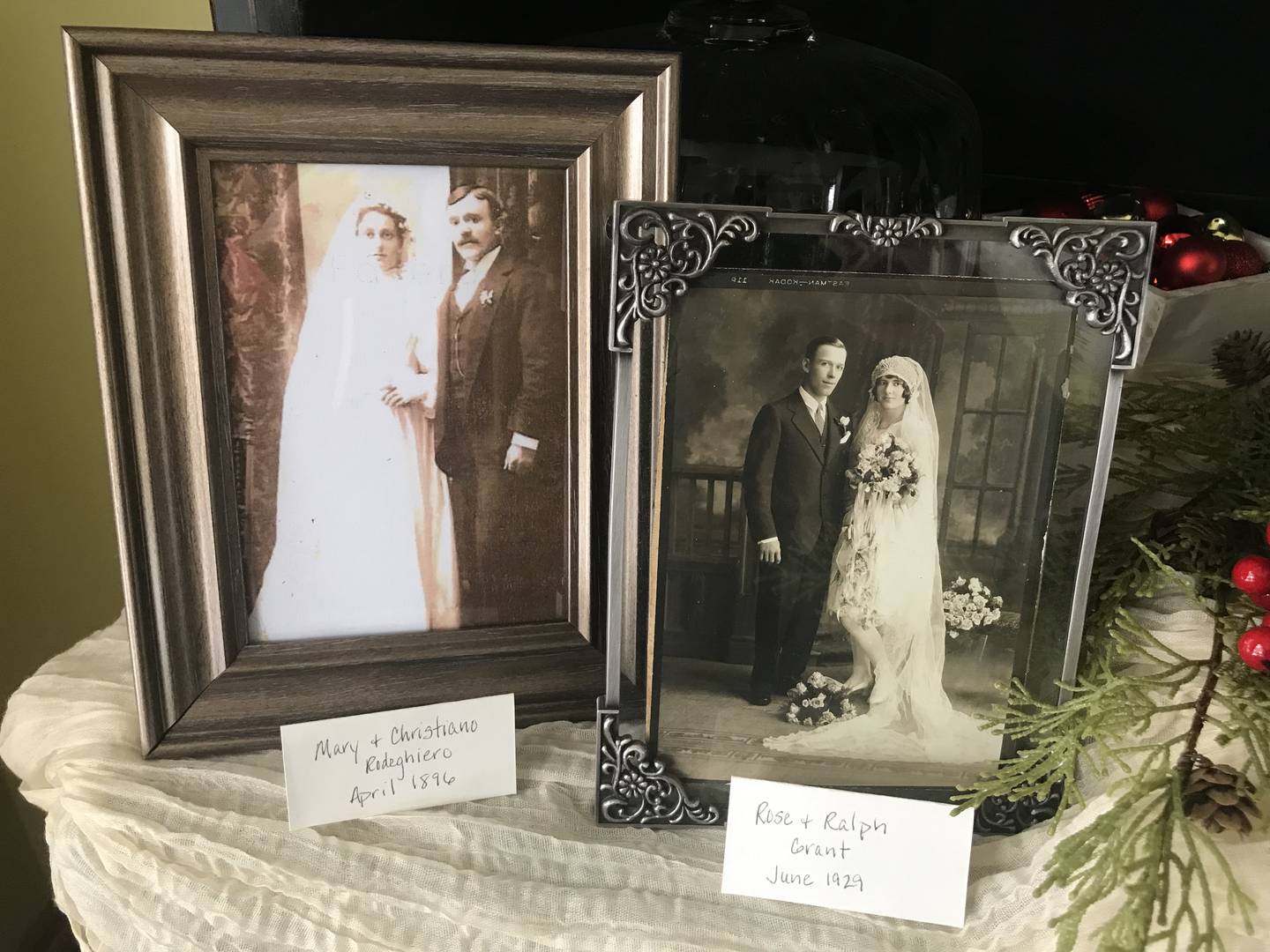 Wedding photos of Mary Dangle, left, and Rose Rodeghiero sit on the stand of Gina Rodewald'’s home. Gina Rodewald's daughter, Abigail Brown, was the fifth generation of women in their family to get married at St. Joseph Catholic Church in Lockport.