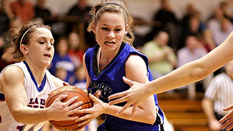 Hinckley-Big Rock's Kaitlin Phillips (at left) and Newark's Lauren Tollefson battle for possession during Little Ten Conference play in this file photo.