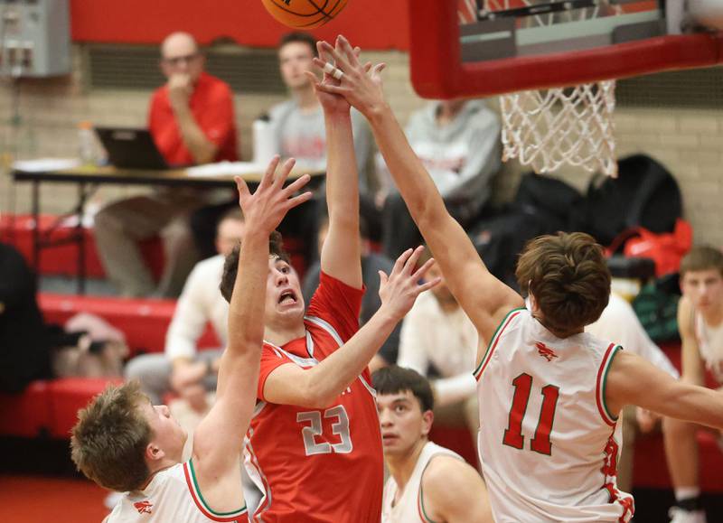 Streator's Colin Byers gets a shot off over L-P defenders Braylin Bond and teammate Jameson Hill during the Dean Riley Shootin' The Rock Thanksgiving Tournament on Monday Nov. 24, 2025 in Kingman Gymnasium at Ottawa High School.