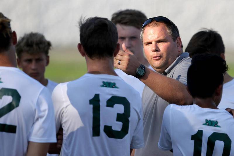 Crystal Lake South coach Brian Allen talks with the Gators during halftime of their boys soccer game on Aug. 30 in Wauconda.