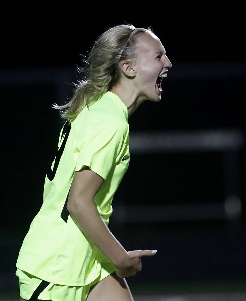 Richmond-Burton's Layne Frericks yells after making a shoot-out goal against Johnsburg's Sophie Person during Kishwaukee River Conference Girls Soccer Tournament Championship Match Wednesday, May 3, 2023, at Richmond-Burton High School.