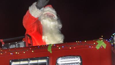 Photos:Santa parades through Utica on a fire engine
