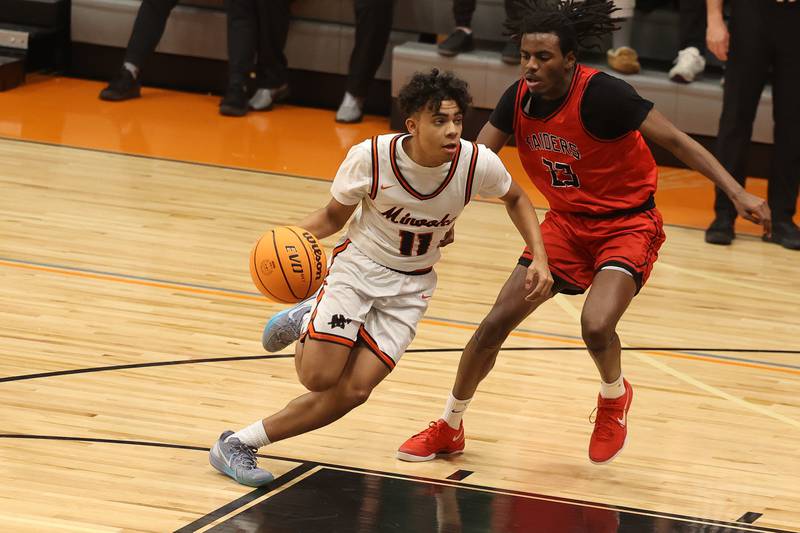 Minooka’s Luke Page makes a move to the paint against Bolingbrook on Tuesday, Dec. 17, 2024 in Minooka.