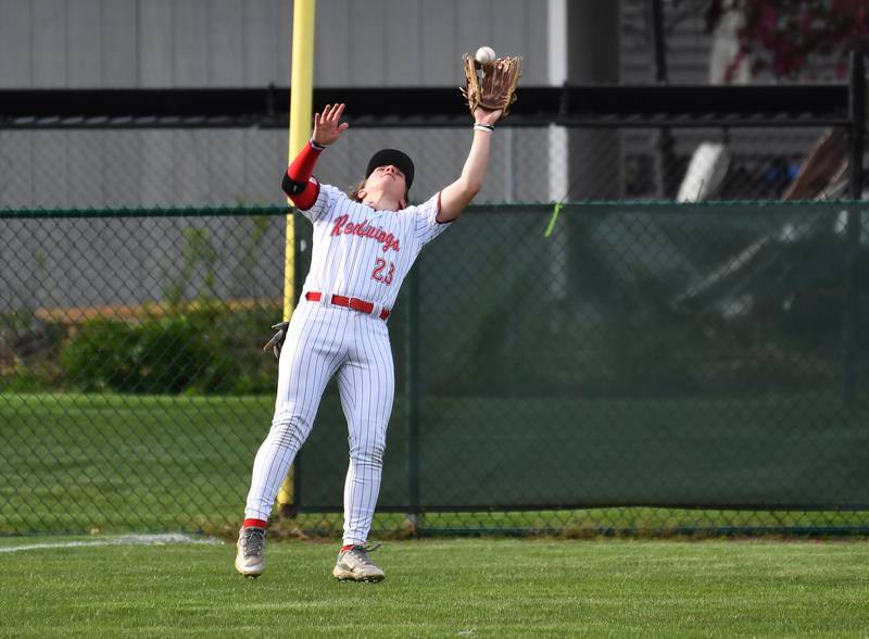 Benet's Nikolas Dabrowski makes a snow cone catch of a wind blown Nazareth fly ball during a game on April 22, 2024 at Benet Academy in Lisle.