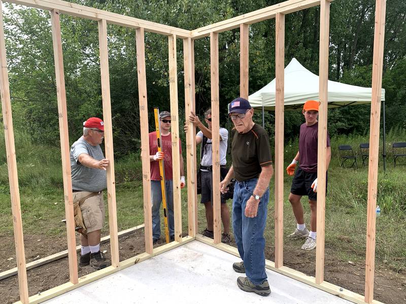 Volunteers work with Sugar Grove resident Christopher Eby to replace a dilapidated shed for the Sugar Grove United Methodist Church (SGUMC). The project was Eby’s his Eagle Project for Sugar Grove Boys Scouts of America Troop No. 41.