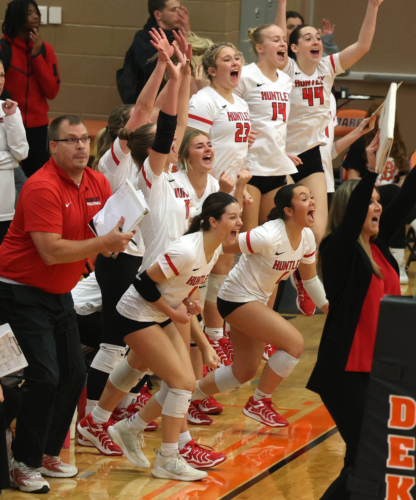 Huntley players celebrate their win in the first game of their match against Fremd Monday, Nov. 11, 2024, in the Class 4A supersectional at DeKalb High School.