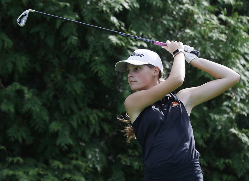 McHenry’s Kilynn Axelson watches her tee shot on the ninth hole during the Fox Valley Conference Girls Golf Tournament Wednesday, Sept. 21, 2022, at Crystal Woods Golf Club in Woodstock.