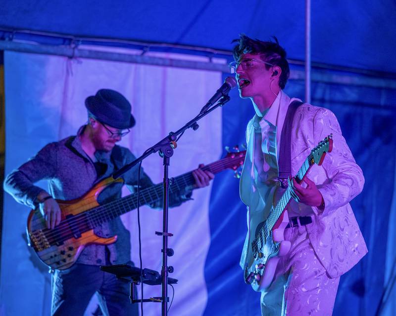 (from left) Kyle Buffo of Harmonix flicks Bass Guitar as bandmate Timmy Campbell sings during the band's performance at Frosty on First on Friday, November 7, 2025 on First Street in La Salle.