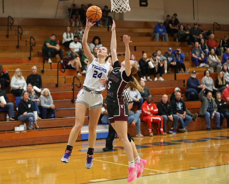 Princeton's Keighley Davis runs in for a layup as Illinois Valley Centra's Taryn Johnigk defends during the Princeton High School Girls Basketball Holiday Tournament on Saturday, Nov. 22, 2025 at Princeton HIgh School.