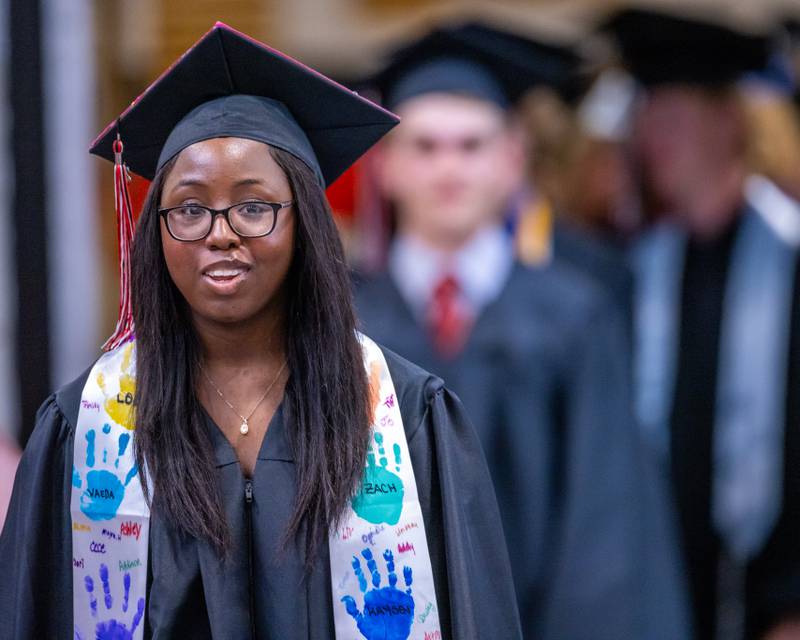 Alona Hunter enters the auditorium at the start of the Woodland High School Class of 2025 commencement ceremony on Sunday, May 18, 2025 at Woodfield High School.