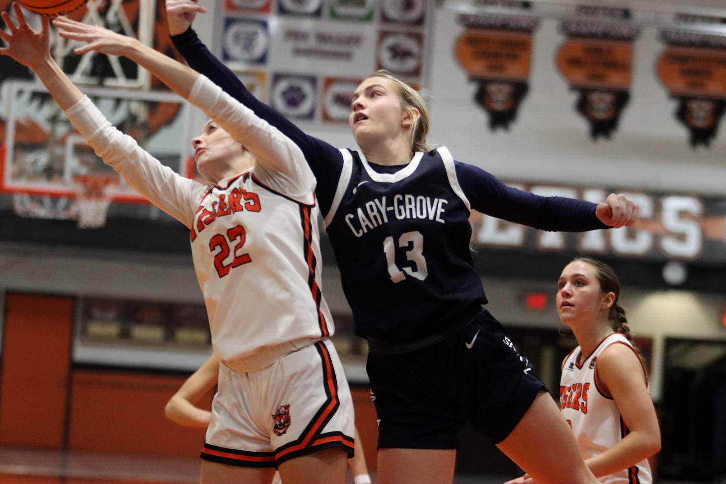 Cary-Grove’s Malaina Kurth, right, battles Crystal Lake Central’s Peyton McMahon for the ball in varsity girls basketball on Tuesday, Jan. 7, 2025, at Crystal Lake Central High School in Crystal Lake.