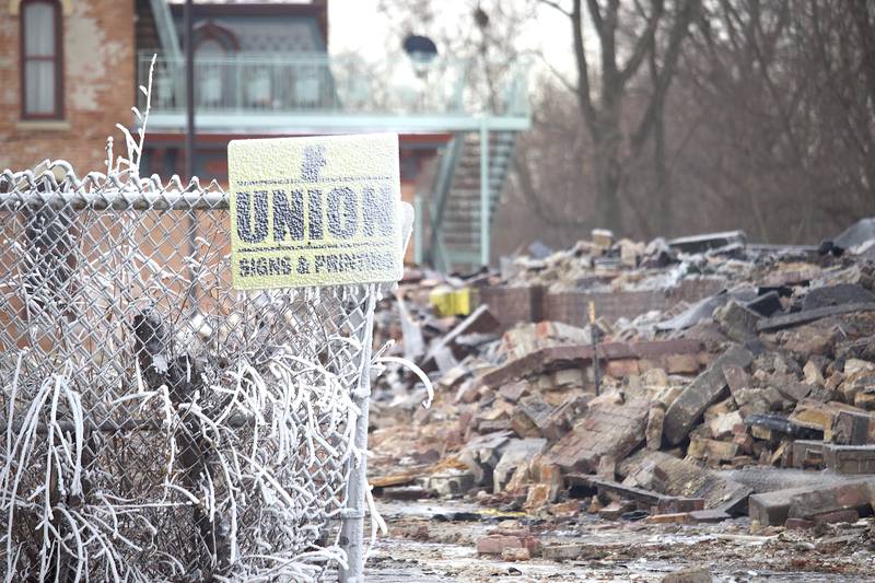The destroyed remains of a commercial building seen on Friday, Jan. 30, 2026, near South Eastern Avenue and Washington Street in Joliet. The building was demolished following a fire on Thursday, Jan. 29, 2026.