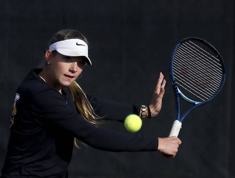 Hinsdale South’s Hinsdale South's Addy Filipiak returns the ball Thursday, Oct. 23, 2025, during the first day of the IHSA State Girls Tennis Tournament at Schaumburg High School.