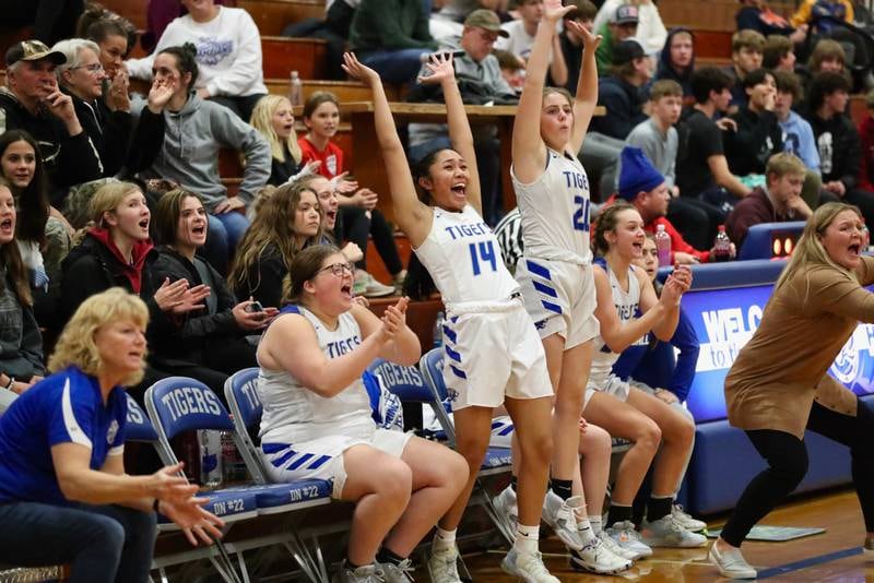 The Princeton bench erupts as Savannah Hollars (45), Gen Tirao (14) and Abby Ward (20) lead the cheers during the Tigresses 35-31 win over rival Bureau Valley Thursday night at Prouty Gym.