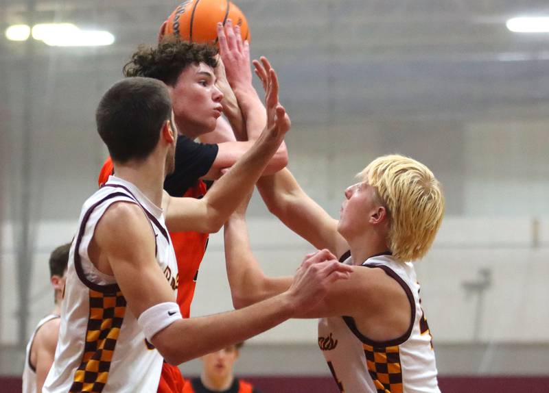 Richmond-Burton’s  Ray Hanneman, right, guards Crystal Lake Central’s Danny Spychala  in varsity boys basketball E.C. Nichols tournament championship game action on Saturday, Dec. 27, 2025, at Homer “Bill” Barry Gymnasium on the campus of Marengo High School in Marengo.