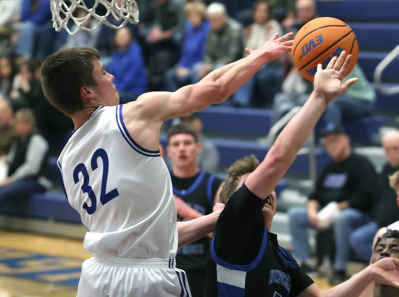Newark's Cody Kulbartz blocks the shot of Hinckley-Big Rock's Luke Badal Friday, Feb. 6, 2026, during their Little 10 Conference third place game at Somonauk High School.