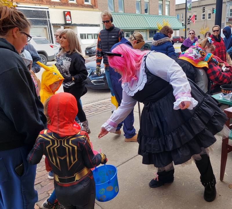 Good Morning, Good Day hands out treats Saturday, Oct. 28, 2023, to costumed children during Streator's downtown trick-or-treating.