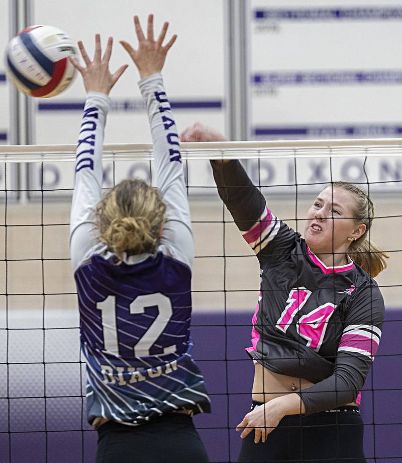 Rock Falls’ Nicolette Udell hammers a shot against Dixon’s Izzy Queckboerner Thursday, Oct. 12, 2023 at Dixon High School.