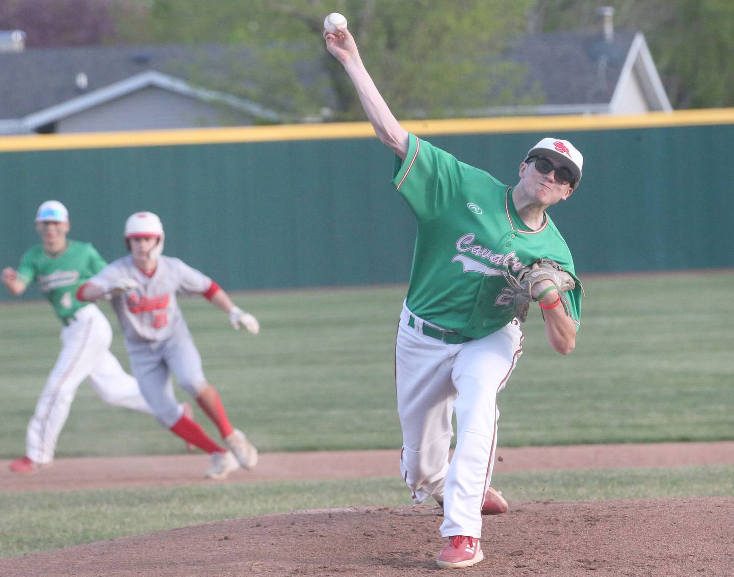L-P's Brandon Foreman throws a pitch as Ottawa's Jace Veith leads off second base at Huby Sarver Field inside the L-P Athletic Complex on Tuesday, April 23, 2024 in La Salle.