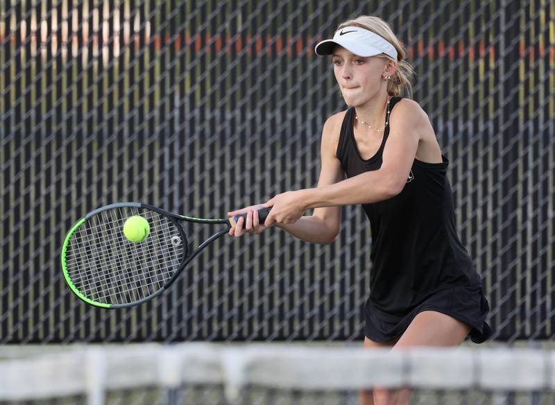 Sycamore’s Madyson Block hits a backhand during her match against DeKalb Wednesday, Sept. 13, 2023, at DeKalb High School.