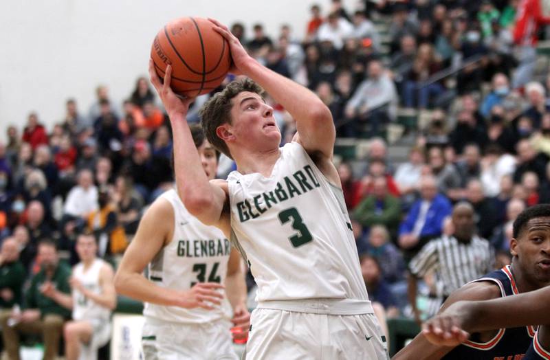 Glenbard West’s Caden Pierce (3) looks for an opening during a Class 4A Bartlett Sectional semifinal game against Naperville North on Tuesday, March 1, 2022.