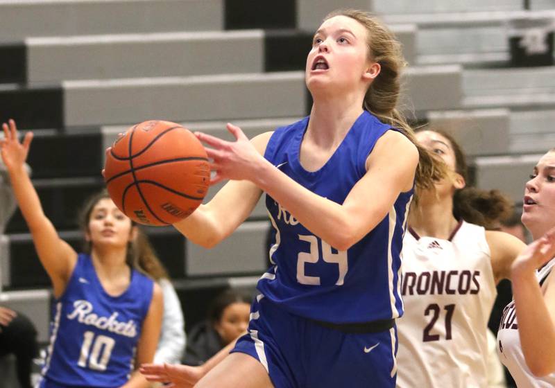 Burlington Central's Page Erickson gets to the basket in front of Montini's Alyssa Epps during their game Tuesday, Feb. 22, 2022, in the Class 3A Kaneland sectional in Maple Park.