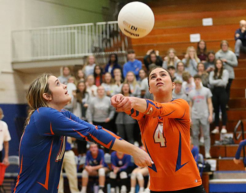 Genoa-Kingston's libero Hannnah Langton (4) sends the ball back to Quincy Notre Dame's side of the net as teammate Rylie Soffregren backs off in the Class 2A Supersectional volleyball game on Friday, Nov. 4, 2022 at Princeton High School.