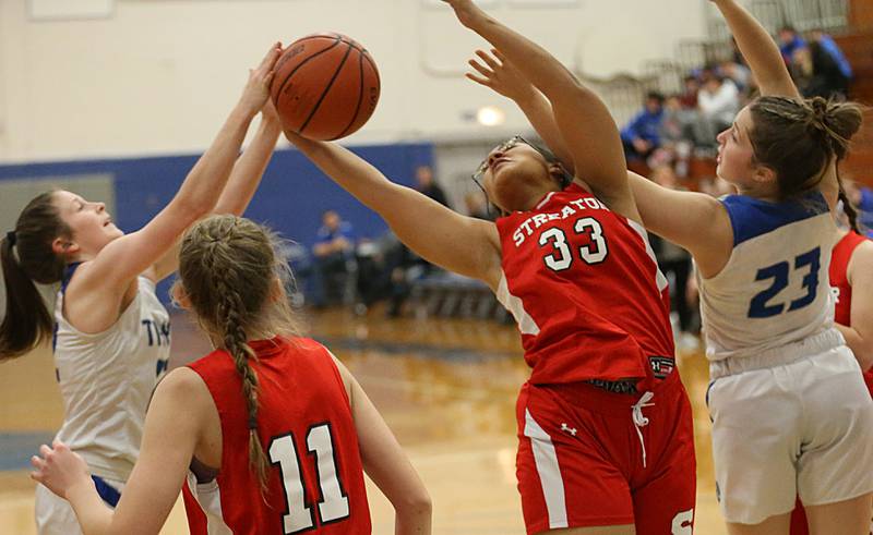 Streator's Jade Williams (33) grabs a rebound over Princeton's Camryn Driscoll (22) in the Lady Tigers Holiday Tournament on Tuesday, Nov. 15, 2022 in Princeton.