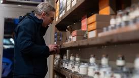 Prices ticked up in November as Americans keep spending, a key inflation measure shows