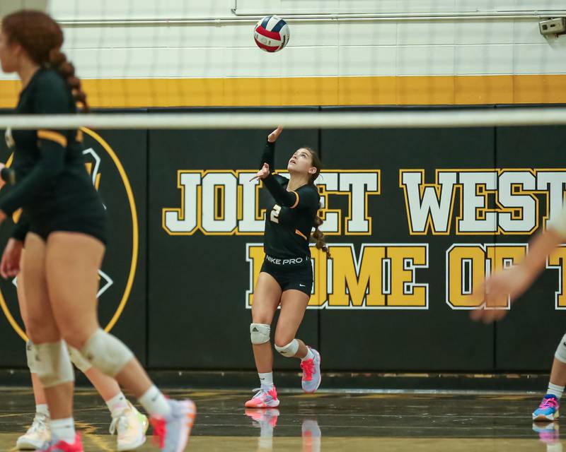 Joliet West's Taylor Brenczewski (2) serves during regional final volleyball match between Bolingbrook at Joliet West.  Oct 26, 2023.