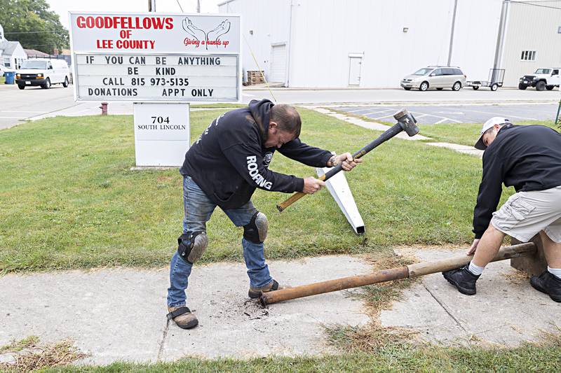 Keith Persico, head of repairs for Boss Roofing, takes the first whacks at separating a pair of pipes in search of a time capsule Wednesday, Sept. 13, 2023.