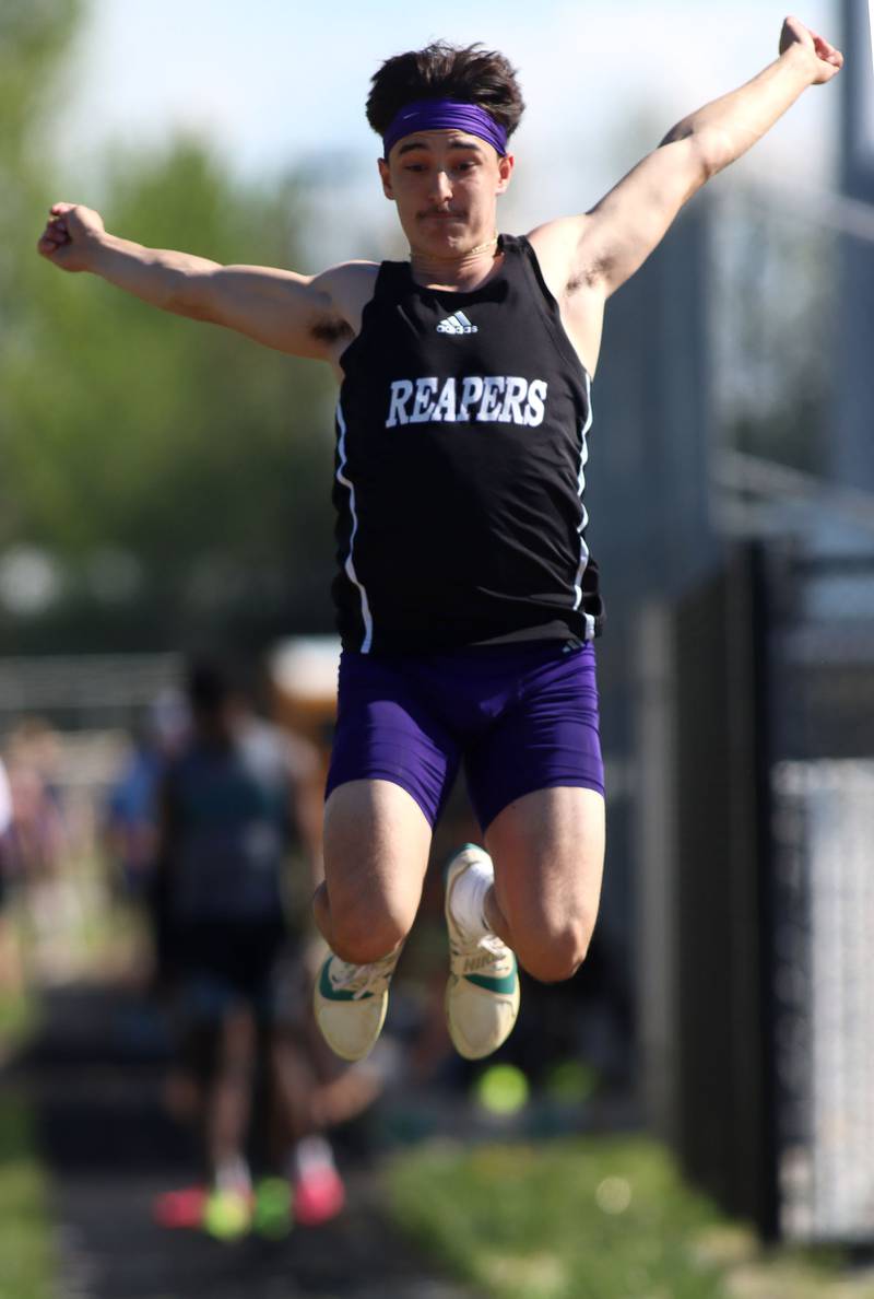 Plano’s Tristan Meszaros competes in the long jump in KRC Conference Track Meet action at Richmond-Burton High School in Richmond on Tuesday, May 13, 2025.