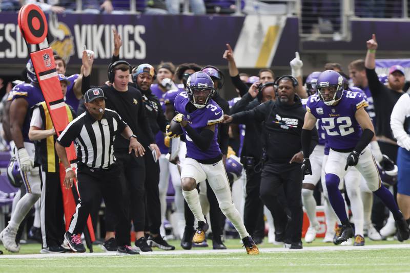 Minnesota Vikings cornerback Cameron Dantzler Sr. carries the ball after stripping it from former teammate Chicago Bears wide receiver Ihmir Smith-Marsette, not pictured, during the second half, Sunday, Oct. 9, 2022 in Minneapolis.